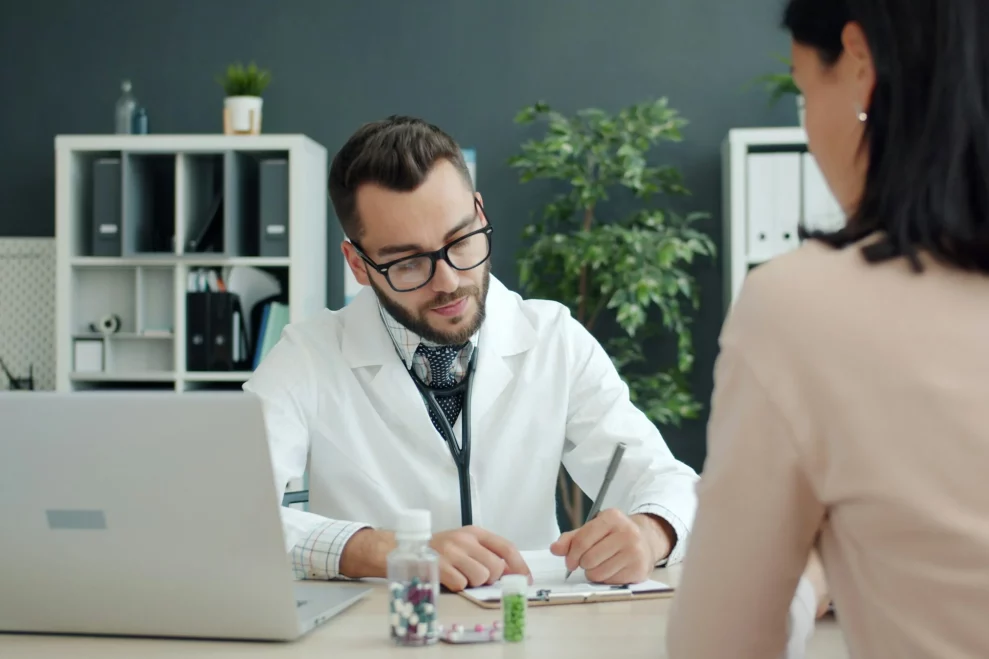 A healthcare professional reviewing information with a patient