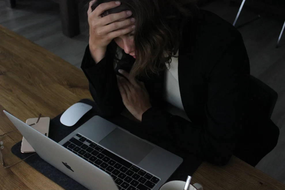 Tired professional resting at a desk
