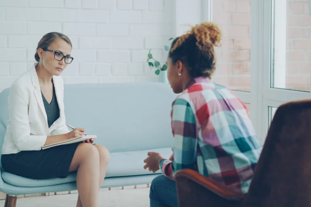 Psychologist listening to a client during an evaluation